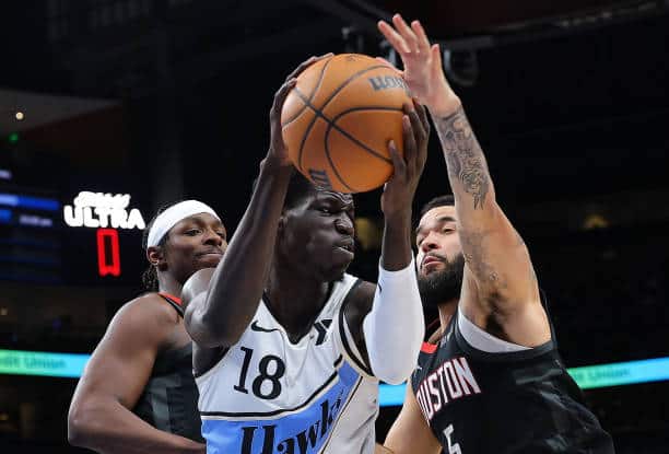 ATLANTA, GEORGIA - JANUARY 28:  Mouhamed Gueye #18 of the Atlanta Hawks battles for a rebound against Jae'Sean Tate #8 and Fred VanVleet #5 of the Houston Rockets during the second quarter at State Farm Arena on January 28, 2025 in Atlanta, Georgia.  NOTE TO USER: User expressly acknowledges and agrees that, by downloading and/or using this photograph, user is consenting to the terms and conditions of the Getty Images License Agreement.  (Photo by Kevin C. Cox/Getty Images)