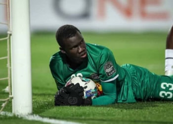 Alioune Badara Faty, the goalkeeper of T.P. Mazembe, is saving the ball during the CAF Champions League semi-final return match between Al-Ahly and Tout Puissant Mazembe at Cairo International Stadium in Cairo, Egypt, on April 26, 2024. (Photo by Ayman Aref/NurPhoto via Getty Images)