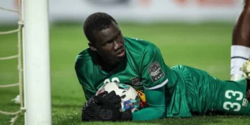 Alioune Badara Faty, the goalkeeper of T.P. Mazembe, is saving the ball during the CAF Champions League semi-final return match between Al-Ahly and Tout Puissant Mazembe at Cairo International Stadium in Cairo, Egypt, on April 26, 2024. (Photo by Ayman Aref/NurPhoto via Getty Images)