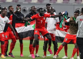 Sudan's players celebrate after winning the 2021 FIFA Arab Cup qualifying football match between Libya and Sudan at Khalifah International Stadium in Doha, Qatar, on June 19, 2021. (Photo by KARIM JAAFAR / AFP)