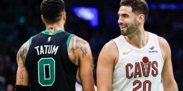 BOSTON, MASSACHUSETTS - NOVEMBER 19: Georges Niang #20 of the Cleveland Cavaliers reacts alongside Jayson Tatum #0 of the Boston Celtics during the third quarter of the Emirates NBA Cup at TD Garden on November 19, 2024 in Boston, Massachusetts. NOTE TO USER: User expressly acknowledges and agrees that, by downloading and or using this photograph, User is consenting to the terms and conditions of the Getty Images License Agreement.  (Photo by Winslow Townson/Getty Images)