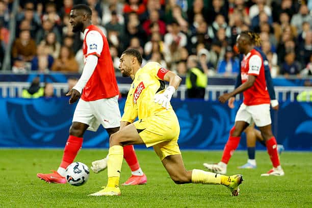 L'OL menacé de relégation, Reims en pôle pour récupérer sa place en Ligue 1 - wiwsport PARIS, FRANCE - MAY 24: Reims goalkeeper Yehvann Diouf during the French Cup Final between Paris Saint-Germain (PSG) and Stade de Reims at Stade de France on May 24, 2025 in Saint-Denis near Paris, France. (Photo by Jean Catuffe/Getty Images)