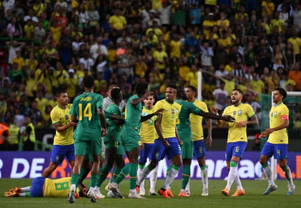 LISBON, PORTUGAL - JUNE 20: Éder Militão of Brazil and Nicolas Jackson of Senegal clash over a foul during an International Friendly match between Brazil and Senegal at Estadio Jose Alvalade on June 20, 2023 in Lisbon, Portugal. (Photo by Zed Jameson/MB Media/Getty Images)