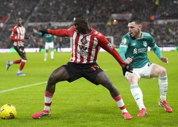 Sunderland's Habib Diarra (left) and Liverpool's Andrew Robertson battle for the ball during the Premier League match at the Stadium of Light, Sunderland. Picture date: Wednesday February 11, 2026. (Photo by Danny Lawson/PA Images via Getty Images)