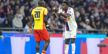 Malang SARR of Lens and Moussa NIAKHATÉ of Olympique Lyonnais during French Cup match between Lyon and Lens at Groupama Stadium on March 5, 2026 in Lyon, France. (Photo by Daniel Derajinski/Icon Sport via Getty Images)