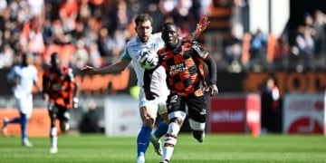 Bamba DIENG of FC Lorient ans Pierre EMILE-HOJBJERG of Marseille during the Ligue 1 McDonald's match between Lorient and Marseille at Stade du Moustoir on April 18, 2026 in Lorient, France. (Photo by Anthony Bibard/FEP/Icon Sport via Getty Images)