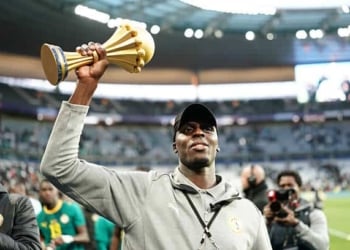 Edouard Mendy of Senegal celebrates with the AFCON trophy after the friendly match between Senegal and Peru at Stade de France on March 28, 2026 in Paris, France. (Photo by Dave Winter/Icon Sport via Getty Images)
