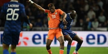 Ivory Coast's defender #20 Emmanuel Agbadou (L) and France's forward #22 Jean Mateta (R) fight for the ball during the international friendly football match between France and Ivory Coast ahead of the 2026 FIFA World Cup football tournament at the Stade de la Beaujoire in Nantes, western France, on June 4, 2026. (Photo by Loic VENANCE / AFP via Getty Images)