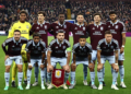 (L-R back row) Aston Villa's Japanese goalkeeper #01 Zion Suzuki, Aston Villa's Spanish defender #14 Pau Torres, Aston Villa's Senegalese striker #11 Nicolas Jackson, Aston Villa's Brazilian striker #47 Alysson, Aston Villa's Swedish defender #03 Victor Lindelof and Aston Villa's English defender  #05 Tyrone Mings, (L-R front row) Aston Villa's Argentinian midfielder #10 Emiliano Buendia, Aston Villa's French born Senagalese striker #19 Ibrahim Mbaye, Aston Villa's Scottish midfielder  #07 John McGinn, Aston Villa's Brazilian midfielder #35 Joao Gomes and Aston Villa's English midfielder  #06 Ross Barkley pose for a team photo ahead of the UEFA Champions League, league phase football match between Aston Villa and Viking at Villa Park in Birmingham, central England on October 21, 2026. (Photo by Henry Nicholls / AFP via Getty Images)