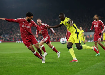 LIVERPOOL, ENGLAND - OCTOBER 20: Pape Gueye of Villarreal CF runs with the ball under pressure from Joe Gomez of Liverpool during the UEFA Champions League 2026/27 League Phase MD3 match between Liverpool FC and Villarreal CF at Anfield on October 20, 2026 in Liverpool, England. (Photo by Dan Istitene/Getty Images)