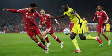 LIVERPOOL, ENGLAND - OCTOBER 20: Pape Gueye of Villarreal CF runs with the ball under pressure from Joe Gomez of Liverpool during the UEFA Champions League 2026/27 League Phase MD3 match between Liverpool FC and Villarreal CF at Anfield on October 20, 2026 in Liverpool, England. (Photo by Dan Istitene/Getty Images)